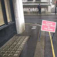 Please do not walk in the road